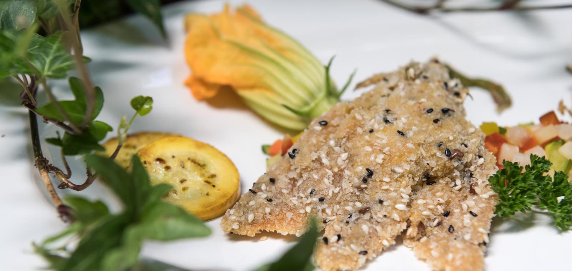 Gluten-Free Stuffed Zucchini flowers in a sesame buckwheat crust