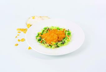 Celery cutlet baked with corn flakes and herb salad