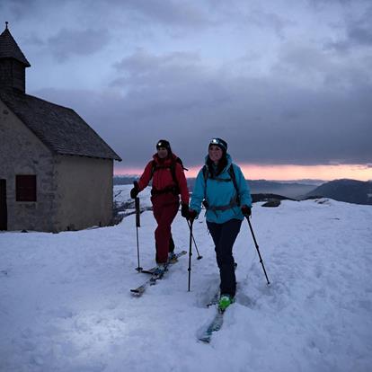 Passing St. Oswald Church while skitouring at Meran 2000