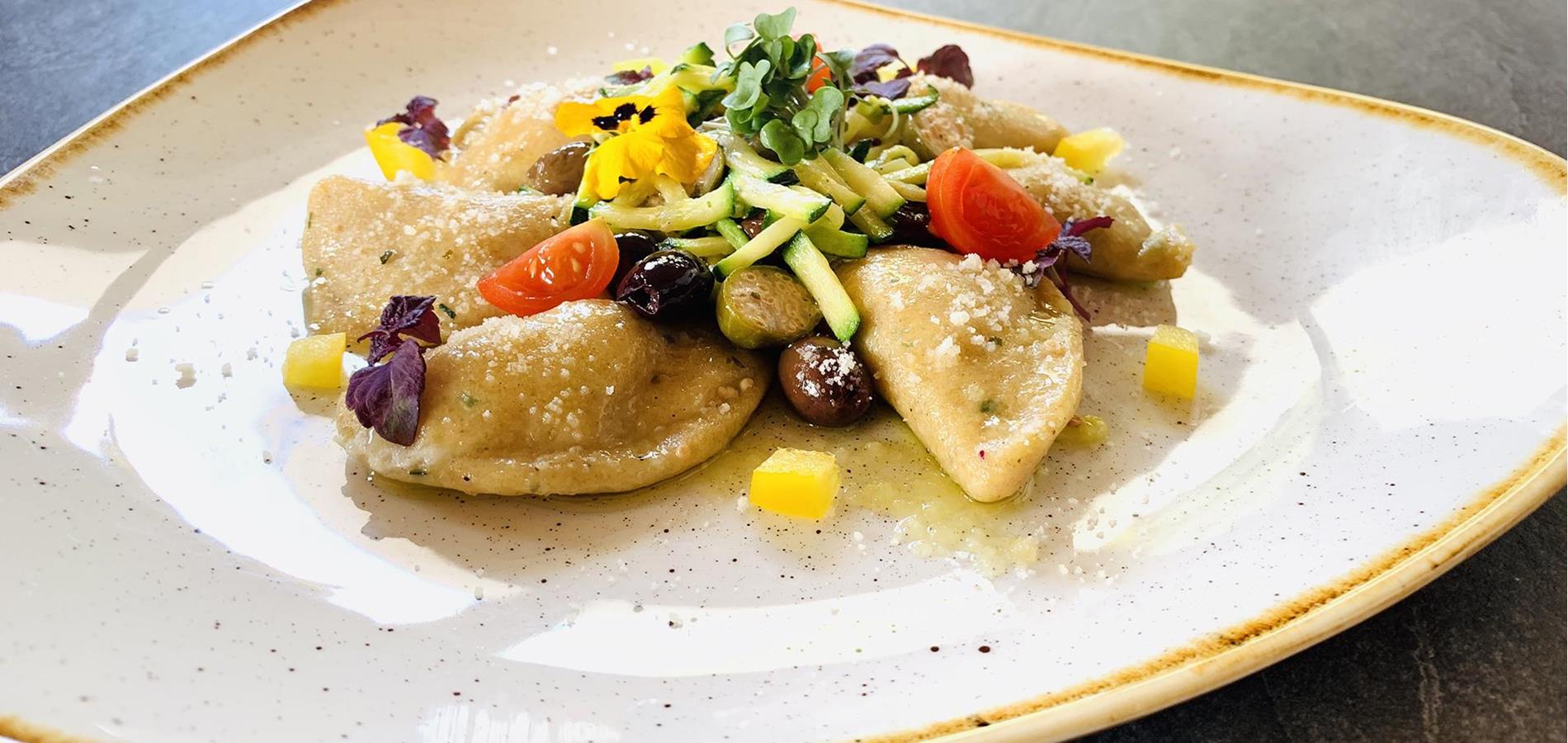 Potato and Spelt Gnocchi filled with fresh river trout from the Passeiertal Valley, capers, courgettes and Taggiasche olives