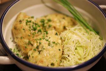 Cheese dumplings with Speck coleslaw