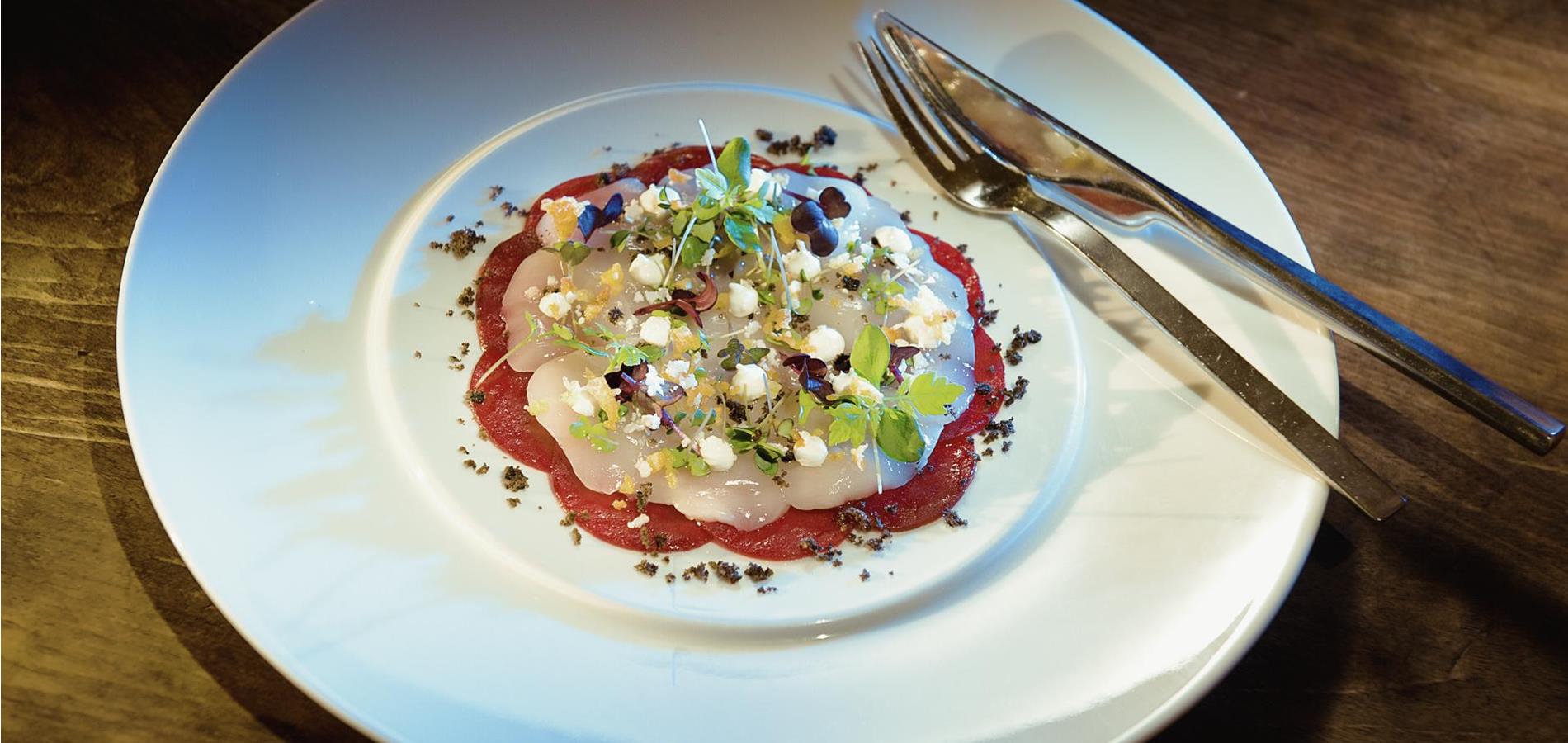 Marinated Passeier Valley trout fillet with beetroot chutney, horseradish dip, leek salad, candied olives and Vinschgau Valley brittle