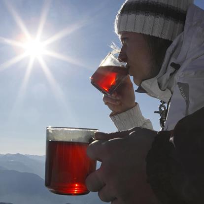 Sun, panoramic view and hot tea at the skiing area Meran 2000