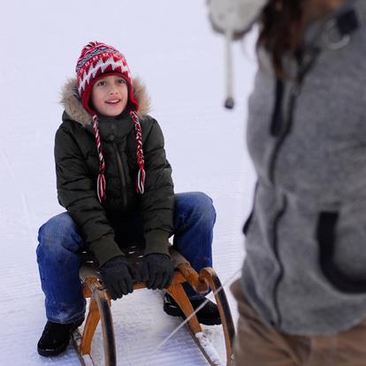 Sledding in the Ultental Valley in Proves